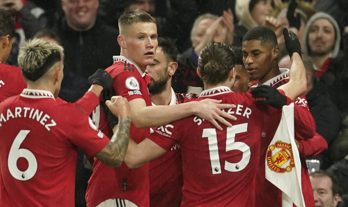 Manchester United's Marcus Rashford, right, celebrates with his teammates after scoring his side's first goal during the English Premier League soccer match against Brentford, at the Old Trafford stadium in Manchester Wednesday. (AP)