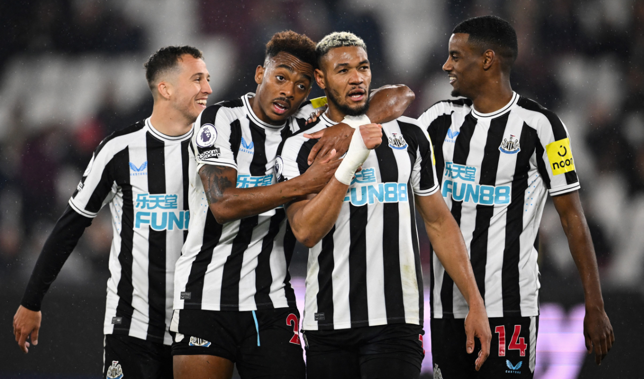 Newcastle United's striker Joelinton (2nd R) celebrates with midfielder Joe Willock (2nd L) after scoring his team fifth goal during the English Premier League football match against West Ham United at the London Stadium, in London on April 5, 2023. (AFP)