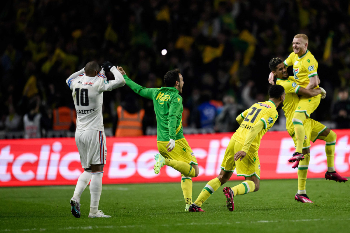 Nantes players celebrate their victory after winning the French Cup semifinal football match between FC Nantes and Lyon at the La Beaujoire Stadium in Nantes, France on April 5, 2023. (AFP)