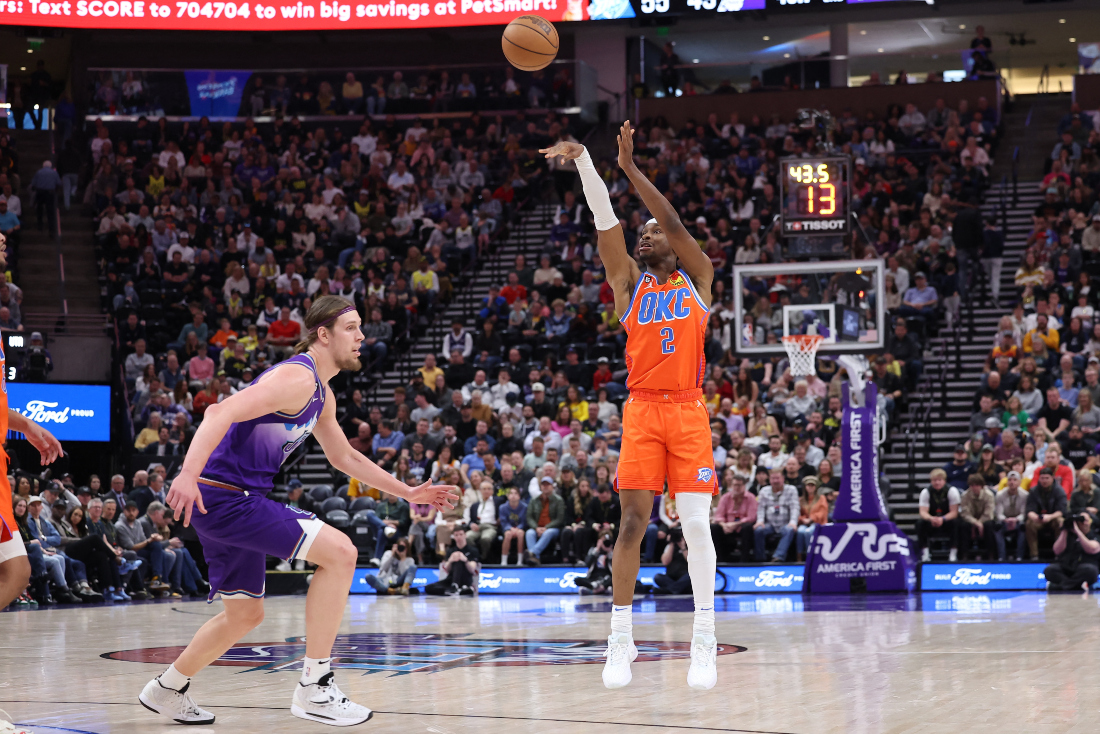 Oklahoma City Thunder guard Shai Gilgeous-Alexander shoots a three point shot over Utah Jazz forward Kelly Olynyk (41) in the second quarter of their NBA game at Vivint Arena. (Supplied)