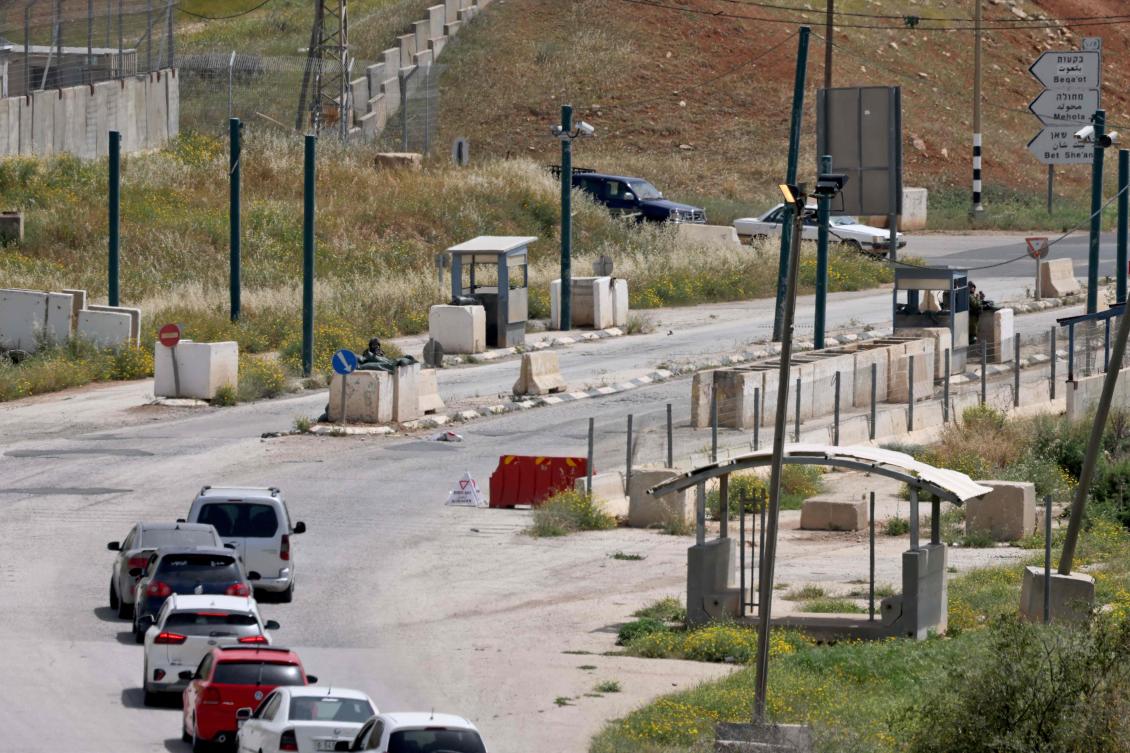Cars line up next to the Hamra junction, in the northern part of the Jordan valley in the occupied West Bank, after the Israeli army closed it following a shooting attack on April 7, 2023. (AFP)