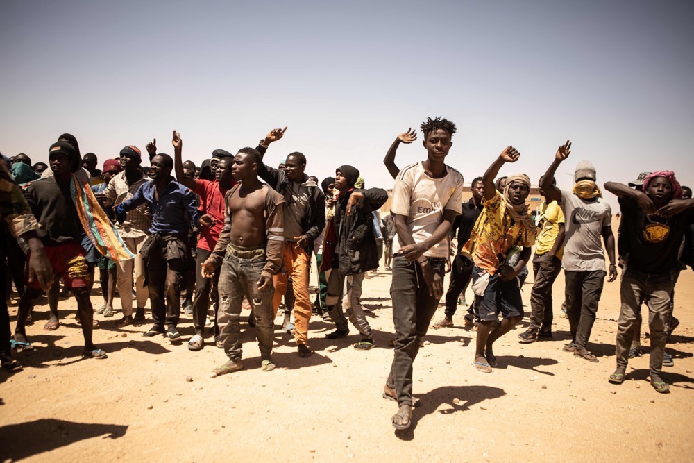 A crowd of migrants gather in Assamaka, Niger, on march 29 2023. (AFP)