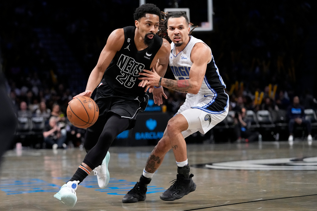 Brooklyn Nets guard Spencer Dinwiddie drives against Orlando Magic guard Cole Anthony during the second half of an NBA basketball game in New York. (AP)