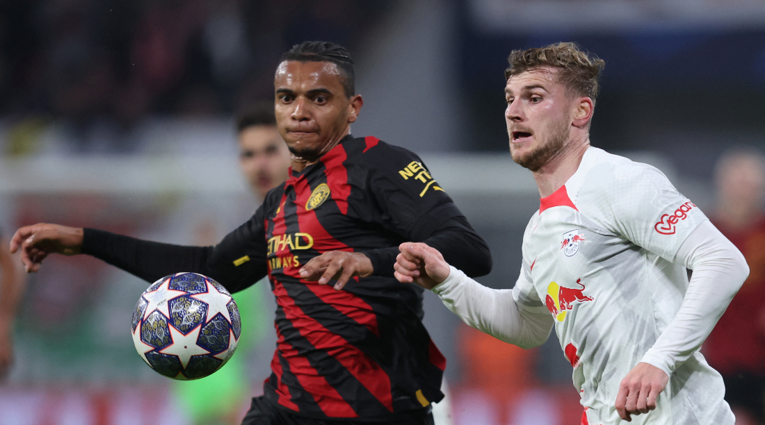 Manchester City's Swiss defender Manuel Akanji (L) and Leipzig's German forward Timo Werner vie for the ball during the UEFA Champions League round of 16. (File/AFP)