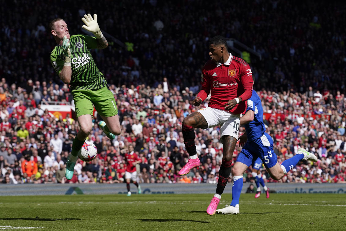 Everton’s goalkeeper Jordan Pickford saves on an attempt to score by Manchester United’s Marcus Rashford during their Premier League match at the Old Trafford stadium in Manchester on Apr. 8, 2023. (AP)