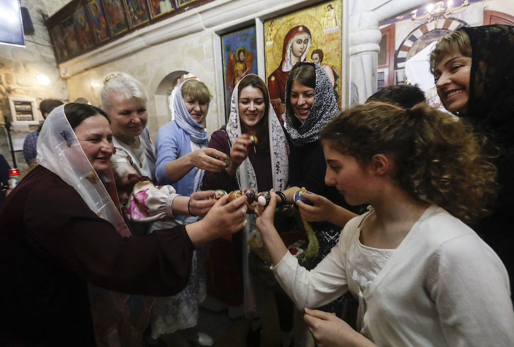 Egg tapping is an Easter tradition in Lebanon but competition may be scarce this year with a box of eggs costing 500,000 Lebanese pounds. (AFP)