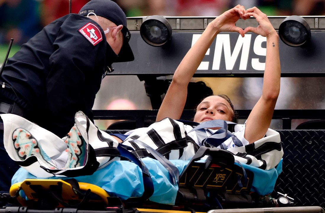 Mallory Swanson of the US makes a heart with her hands for the fans after being injured against the Ireland during the first half of an international friendly at Q2 Stadium on Saturday in Austin, Texas. (GETTY IMAGES NORTH AMERICA / AFP)