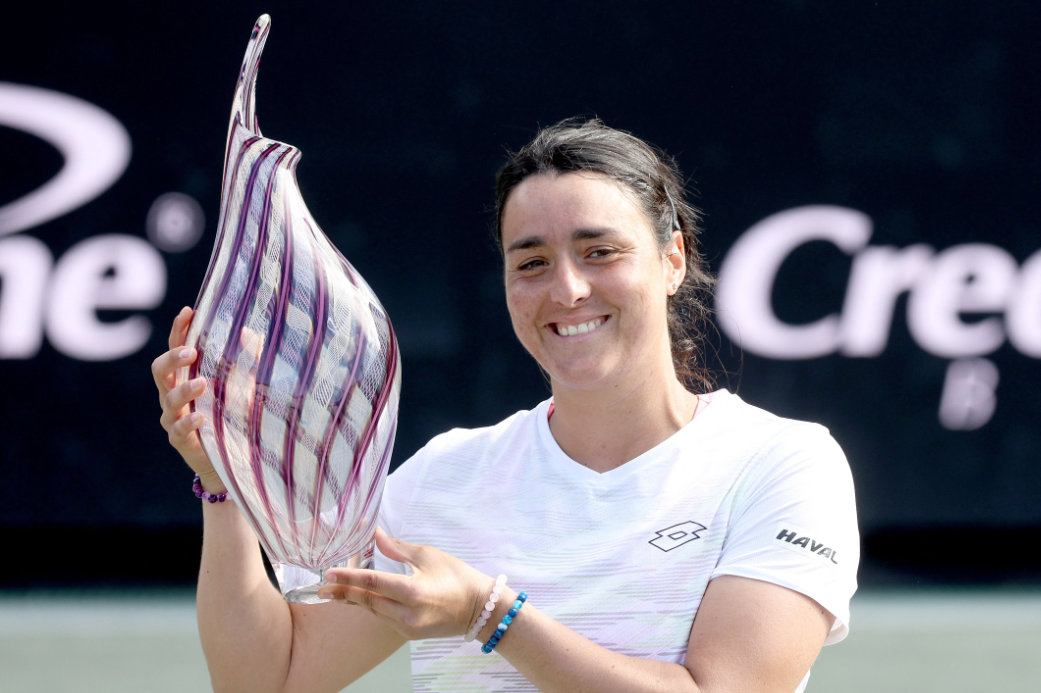 Ons Jabeur of Tunisia poses with the trophy after defeating Belinda Bencic of Switzerland during the Finals of the Credit One Charleston Open at Credit One Stadium on April 09, 2023 in Charleston, South Carolina. (AFP)