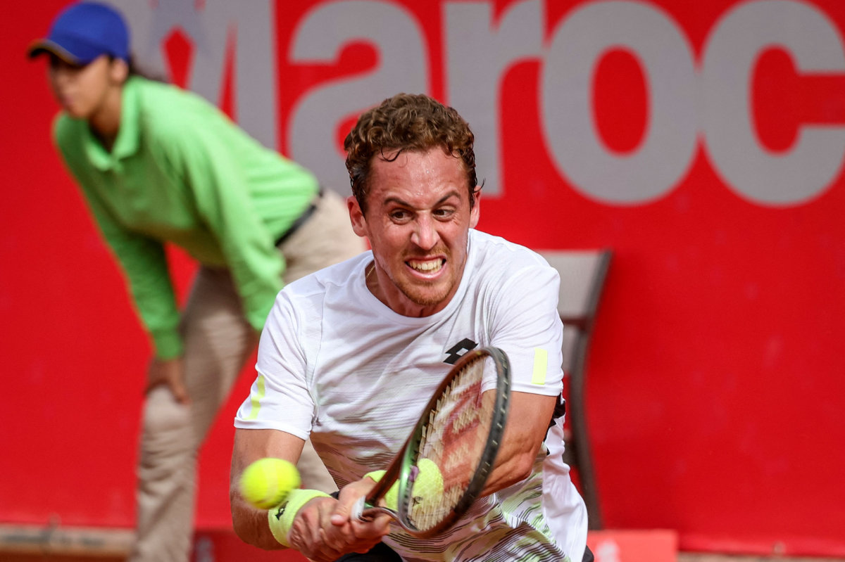 Spain’s Roberto Carballes Baena returns the ball to France's Alexandre Muller during the men's single final tennis match at the Marrakesh Open on April 9, 2023. (AFP)