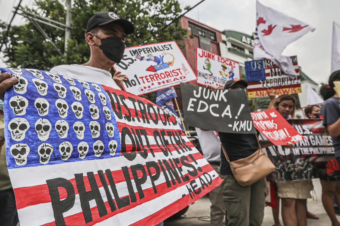 Demonstrators protest the joint military exercises during rally in front of Camp Aguinaldo military headquarters in Quezon City, Philippines on Tuesday, April 11, 2023. (AP)
