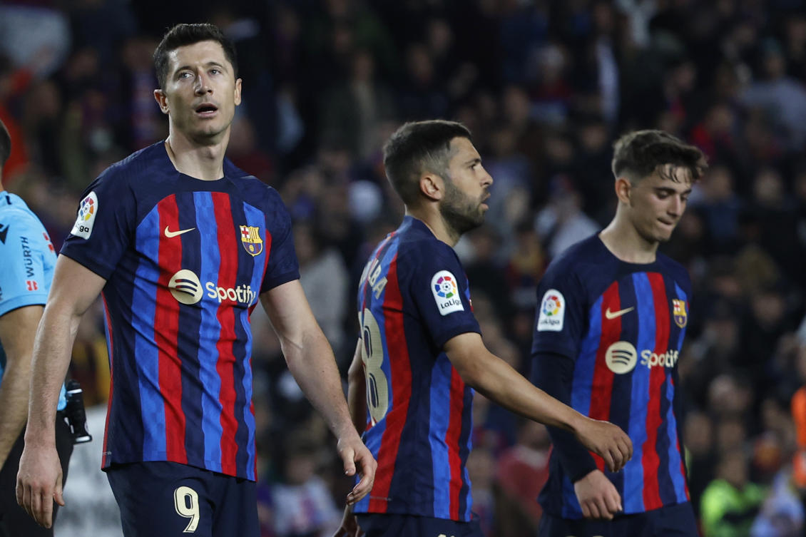 Barcelona's Robert Lewandowski, Gavi and Jordi Alba gesture at the end of their Spanish La Liga match against Girona at the Camp Nou stadium in Barcelona on Apr. 10, 2023. (AP)