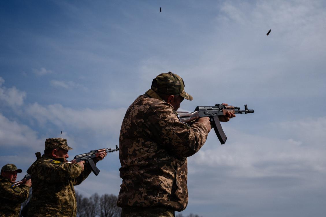 Ukrainian soldiers perform a rifle volley salute during a funeral ceremony in the town of Brovary, outside of Kyiv, on April 11, 2023, for the late Ukrainian serviceman Kostiantyn Starovytskyi, Kyiv's Opera conductor, killed in Donetsk region. (AFP)