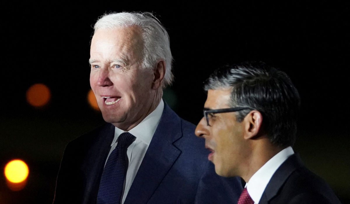 British Prime Minister Rishi Sunak greets U.S. President Joe Biden on his arrival at RAF Aldergrove airbase in County Antrim, Northern Ireland April 11, 2023. (REUTERS)