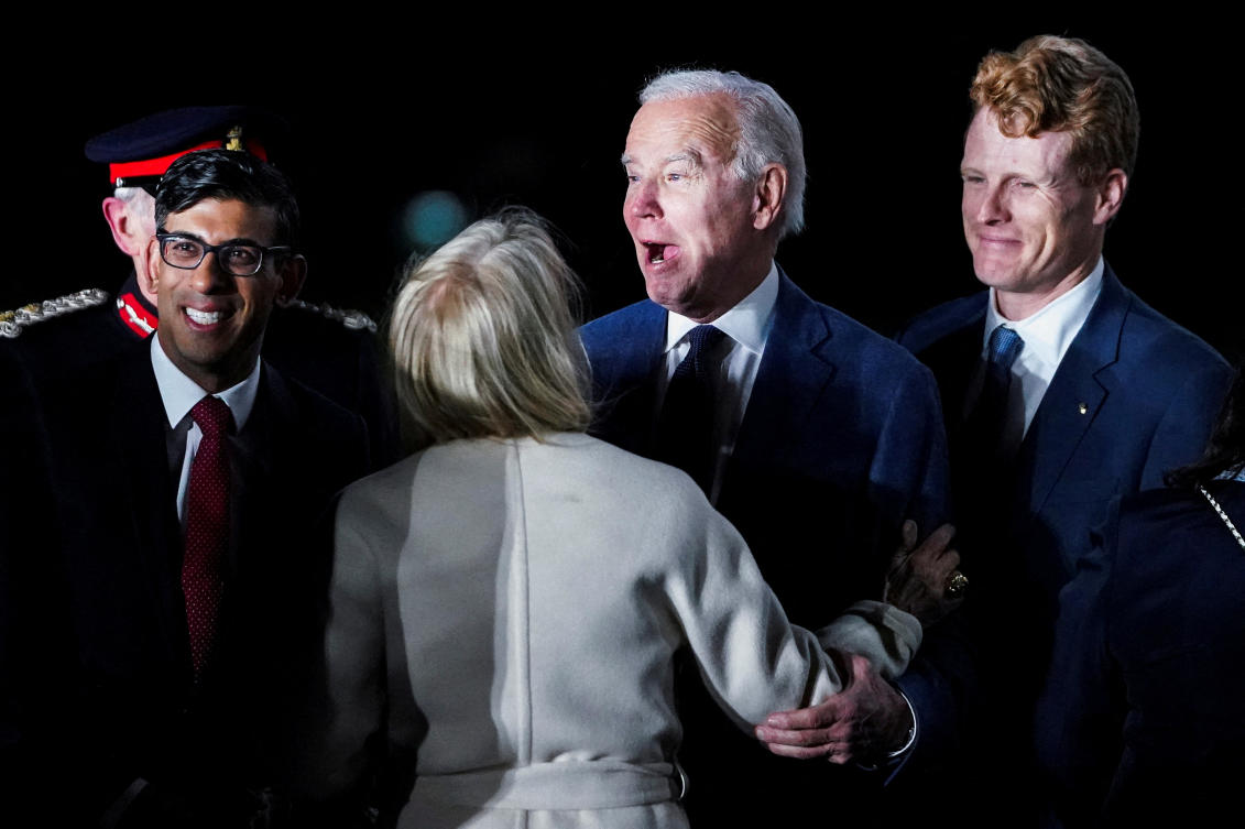 British Prime Minister Rishi Sunak and US Ambassador to the United Kingdom Jane Hartley greet US President Joe Biden next to Joe Kennedy upon Biden's arrival at RAF Aldergrove airbase in County Antrim, Northern Ireland April 11, 2023. (Reuters)