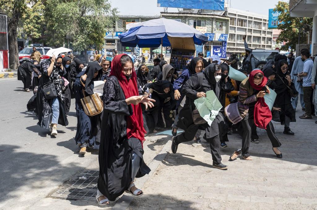 The increasing curbs on women are reminiscent of the Taliban’s first government between 1996 and 2001. Above, Taliban security forces disperse Afghan women protesters in Kabul on Aug. 13, 2022. (AFP)