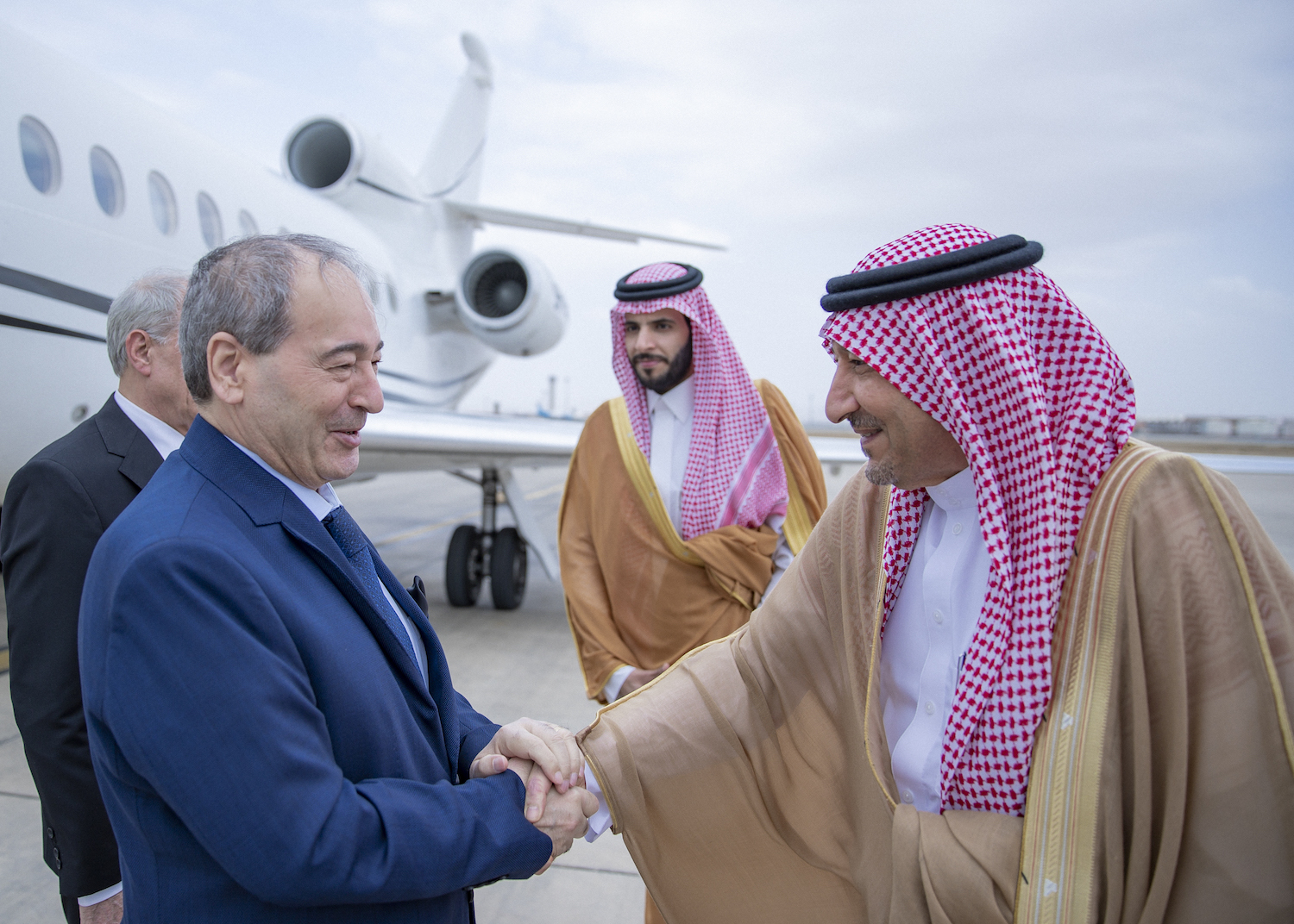 Saudi Arabia’s Deputy Foreign Minister Waleed Al-Khuraiji receives Syrian Foreign Minister Faisal Mekdad at King Abdulaziz International Airport. (SPA)