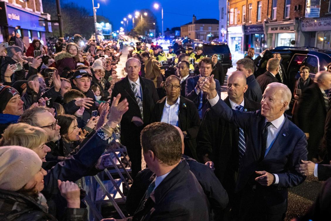 US President Joe Biden, who has declared Ireland to be ‘part of my soul,’ greets the public as he leaves Windsor Bar in Dundalk on April 12, 2023. (AFP)