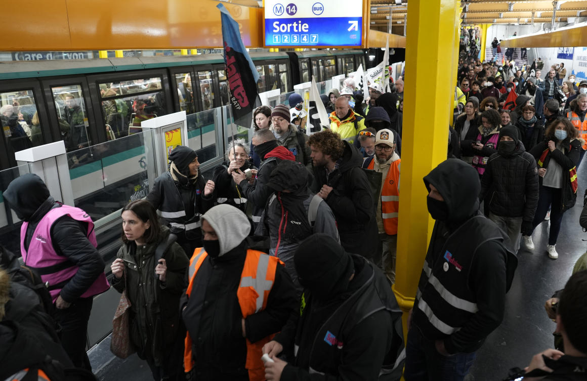 Striking railway workers invade a subway station as they head for a protest on Apr. 13, 2023 in Paris. (AP)