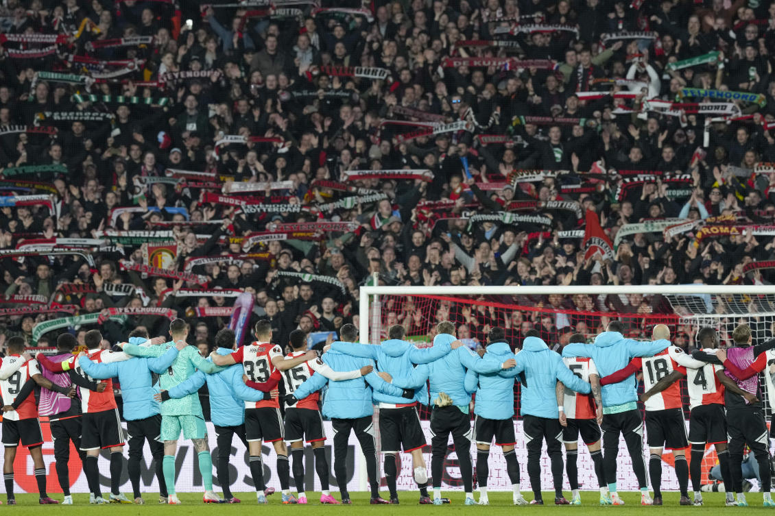 Feyenoord players celebrate at the end of their first leg quarterfinal match against Roma at De Kuip stadium in Rotterdam, Netherlands, on Apr. 13, 2023. (AP)