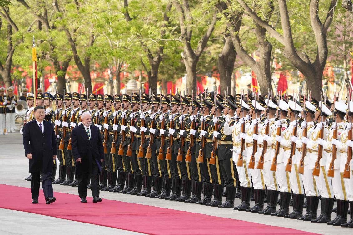 Chinese President Xi Jinping, left, and Brazil’s President Luiz Inacio Lula da Silva attend a welcome ceremony at the Great Hall of the People in Beijing on April 14, 2023. (AFP)