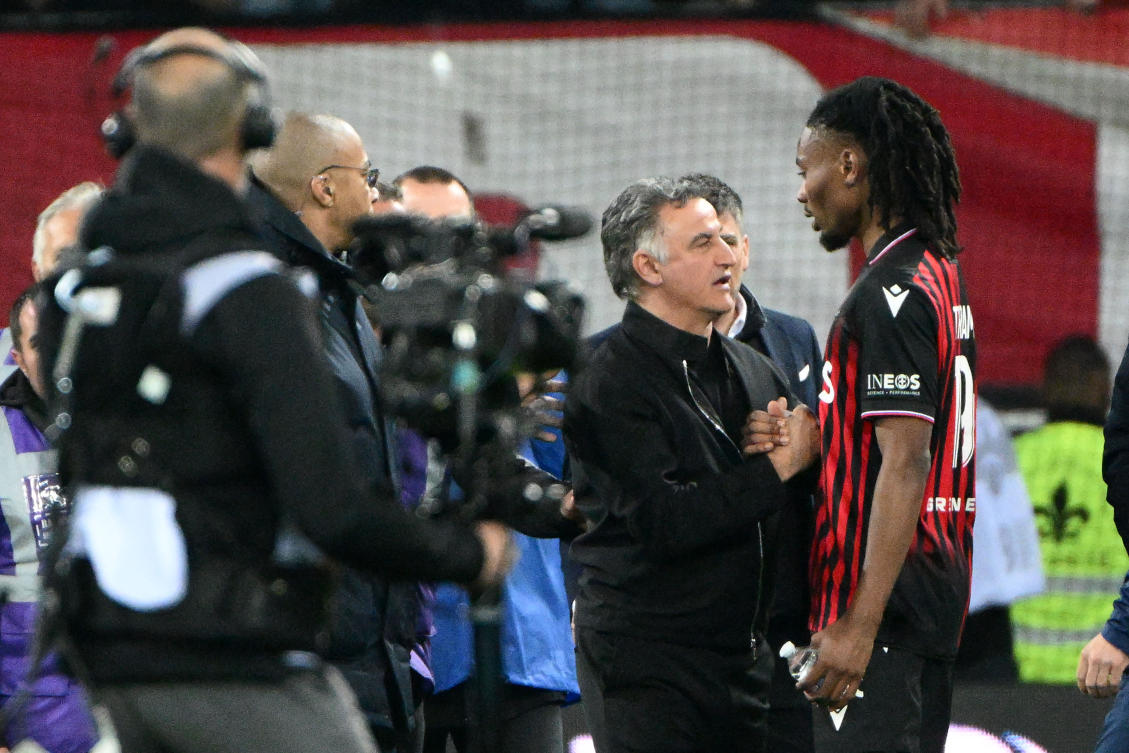 This photograph taken on Apr. 8, 2023, shows PSG’s French coach Christophe Galtier speaking with Nice’s French midfielder Khephren Thuram after their French L1 match at the Allianz Riviera stadium in Nice. (AFP)