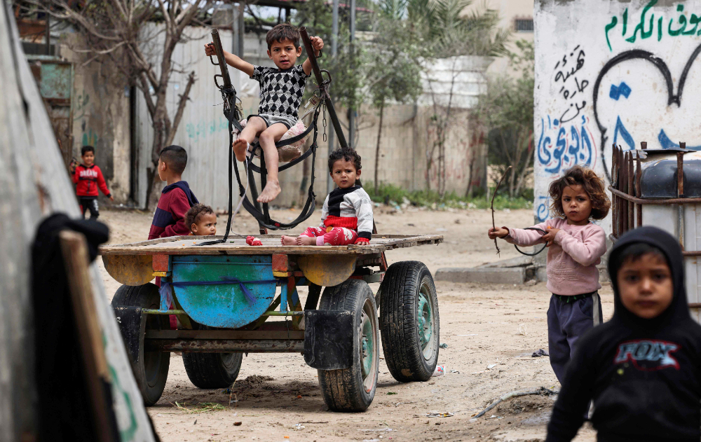 Palestinian children play in Gaza City during the holy month of Ramadan. (AFP)
