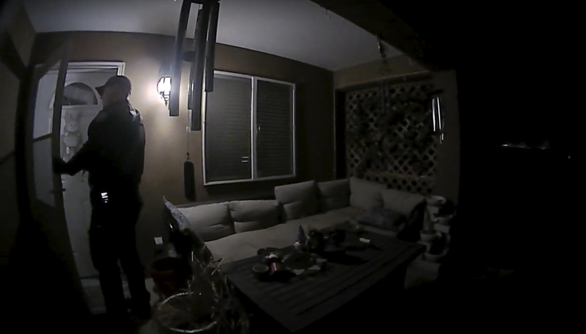 In this image taken from body camera video provided by the Farmington Police Department, a police officer knocks on the door of the wrong address in response to a domestic violence call, in Farmington, N.M., late April 5, 2023. Moments later, the homeowner was fatally shot by police after appearing at the door armed with a handgun. (AP)