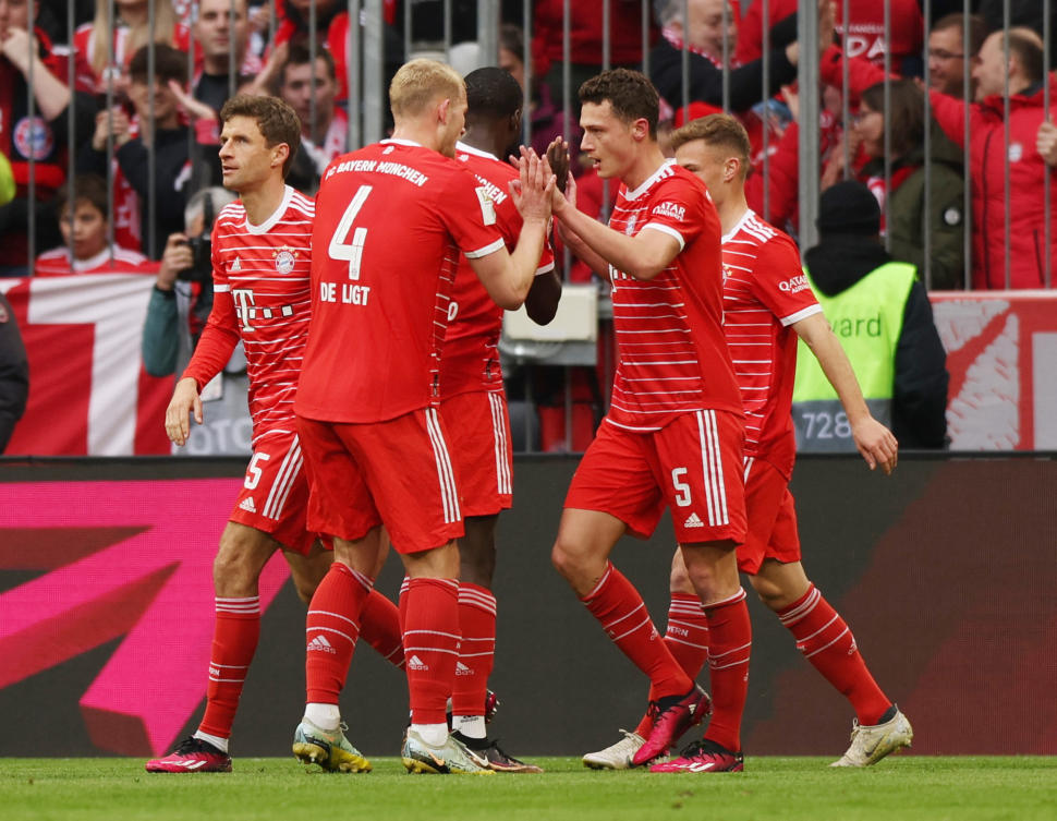 Bayern Munich’s Benjamin Pavard celebrates scoring their first goal with Matthijs de Ligt and Thomas Mueller during their Bundesliga match against TSG 1899 Hoffenheim at Allianz Arena, Munich, on Apr. 15, 2023. (Reuters)