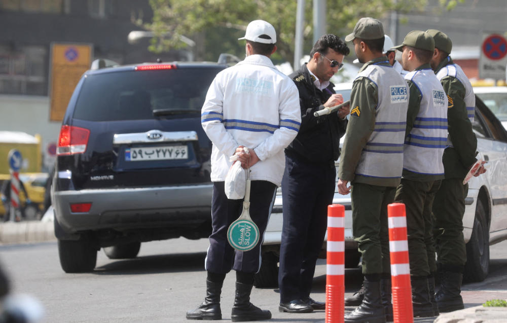 Iran's police forces stand on a street amid the implementation of the new hijab surveillance in Tehran, Iran, April 15, 2023. (REUTERS)