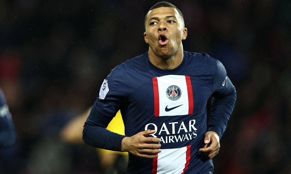Paris Saint-Germain's French forward Kylian Mbappe celebrates after scoring his team's first goal during the French L1 football match between Paris Saint-Germain (PSG) and Lens (RCL) at the Parc des Princes in Paris, on April 15, 2023. (AFP)