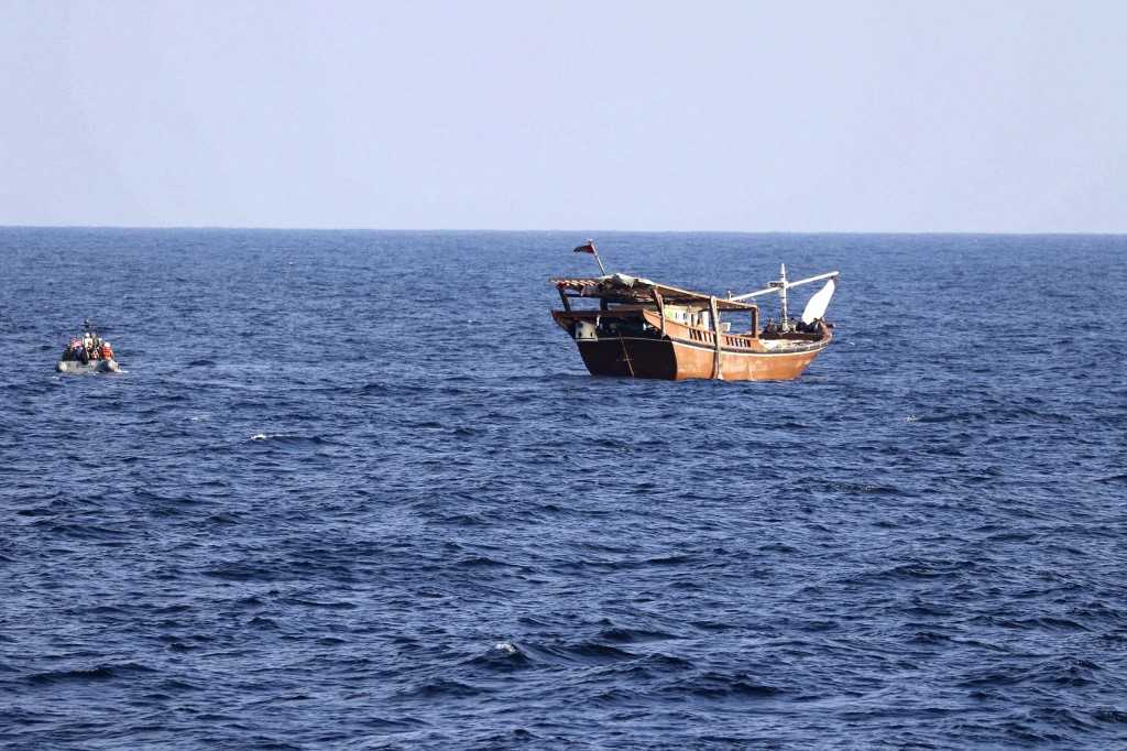 This handout photo released on January 6, 2023, by the US Navy shows a boarding team from the patrol coastal ship USS Chinook approaching a fishing vessel in international waters of the Gulf of Oman. (AFP)