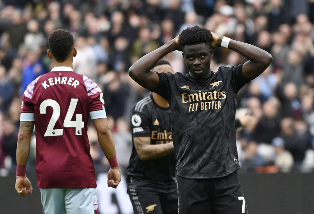 Arsenal’s Bukayo Saka reacts after he misses a penalty in his team’s 2-2 draw with West Ham United. (Reuters)