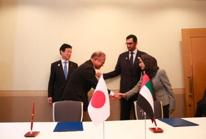 The UAE's Minister of Industry and Advanced Technology Dr Sultan Al Jaber and Japan's Minister of Economy, Trade and Industry Nishimura Yasutoshi witness the signing of the agreements (Twitter/@ADNOCGroup)