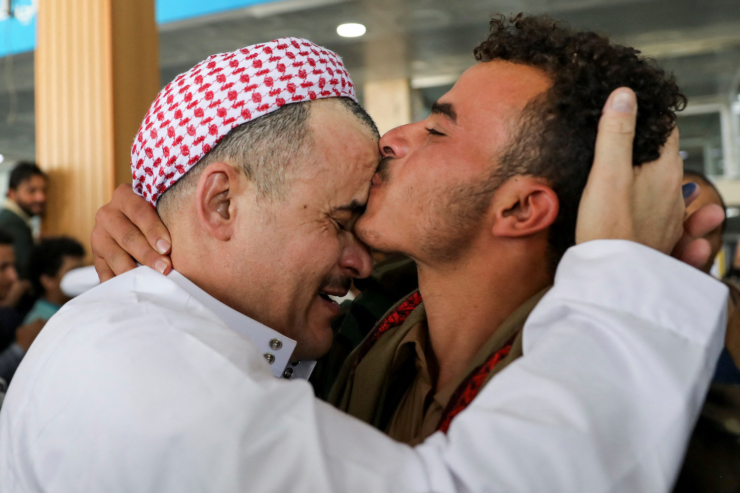 A freed detainee, released unilaterally by Saudi Arabia, embraces a relative at Sanaa Airport after arriving on an ICRC plane in Sanaa, Yemen, April 17, 2023. (Reuters)