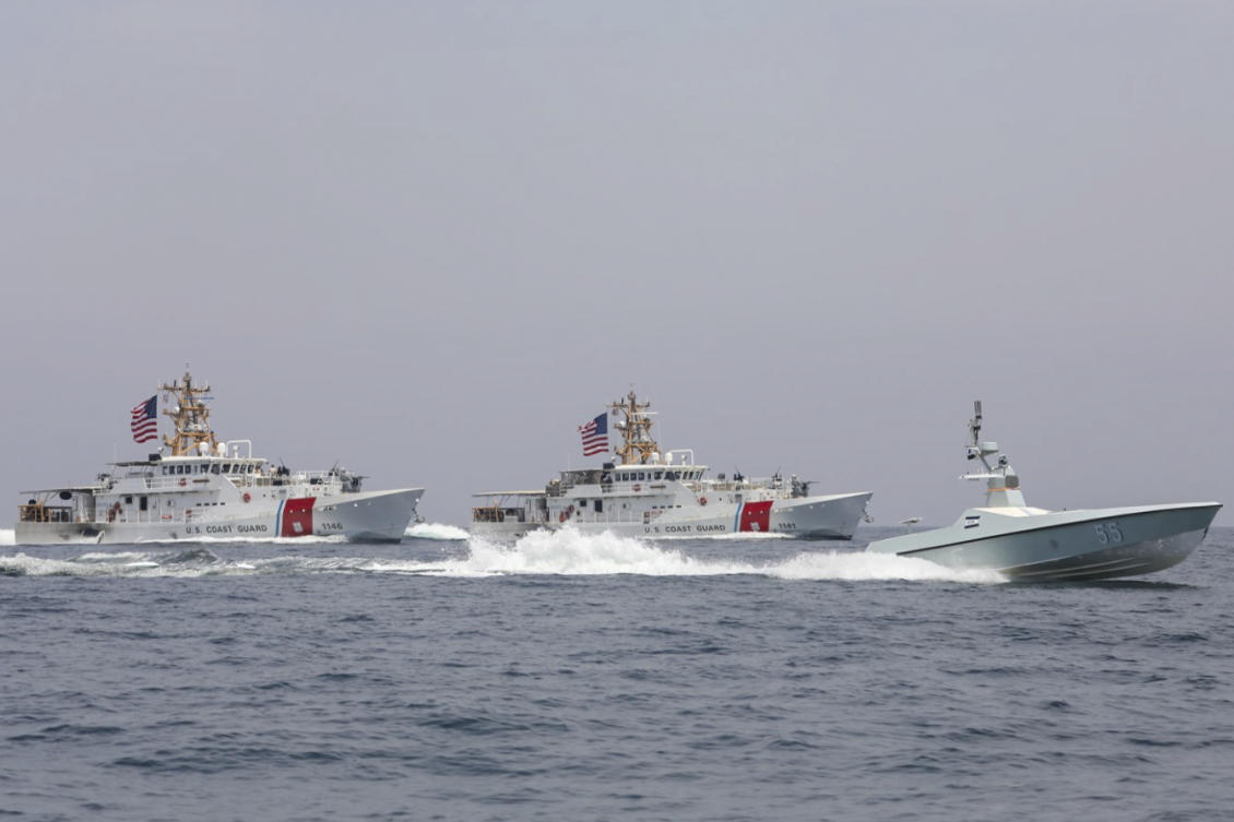 The L3 Harris Arabian Fox MAST-13 is escorted by the USCGC Charles Moulthrope and USCGC John Scheuerman as the drone boat sails through the Strait of Hormuz. (US Coast Guard via AP)