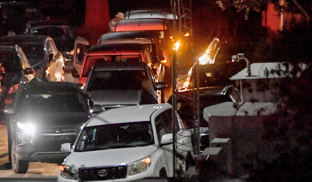 Security forces' vehicles are seen outside the home of the head of Tunisia's Islamist movement Ennahdha Rached Ghannouchi in Tunis on April 17, 2023. (AFP)