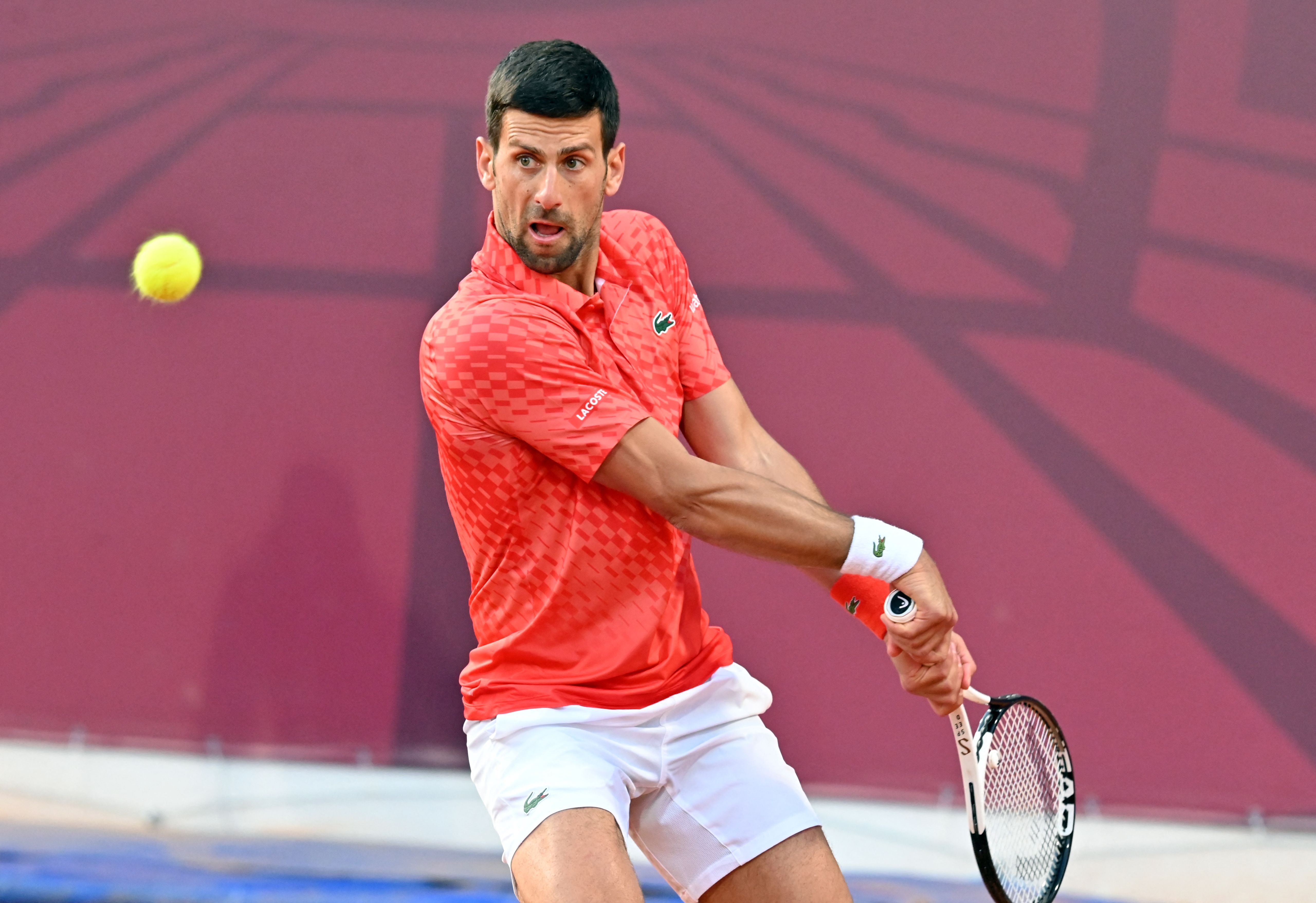 Serbia's Novak Djokovic plays a backhand return to France's Luca van Assche during their tennis singles match at the Sprska Tennis Open ATP 250 series tournament in Banja Luka, on Wednesday. (AFP)