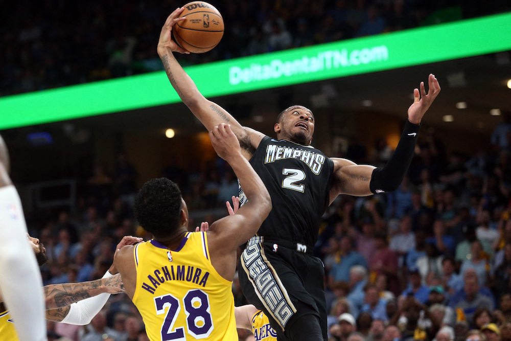 Memphis Grizzlies forward Xavier Tillman collects a rebound over Los Angeles Lakers forward Rui Hachimura during the second half of Game 2 of their 2023 NBA playoffs at FedExForum. (USA TODAY Sports)