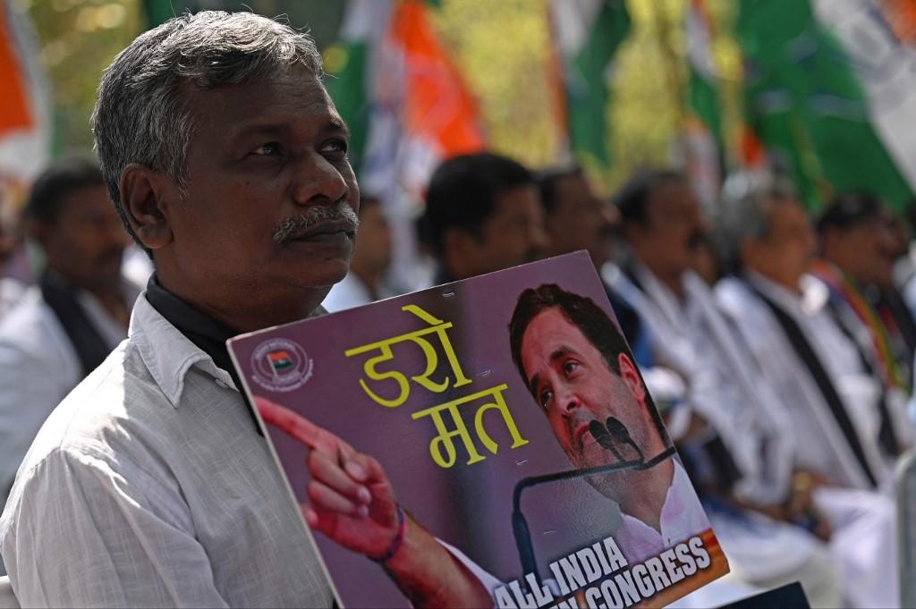 Activists take part in a protest against the disqualification of India’s Congress party leader Rahul Gandhi from the Indian parliament, after his conviction in a defamation case, on April 3, 2023. (AFP)