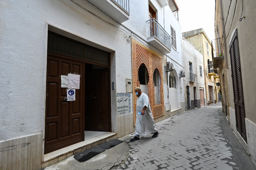 Above, a Muslim faithful enters Ettakwa Mosque housed in a room of the Mazara del Vallo’s Casbah in Trapani Sicily. (AFP file photo)