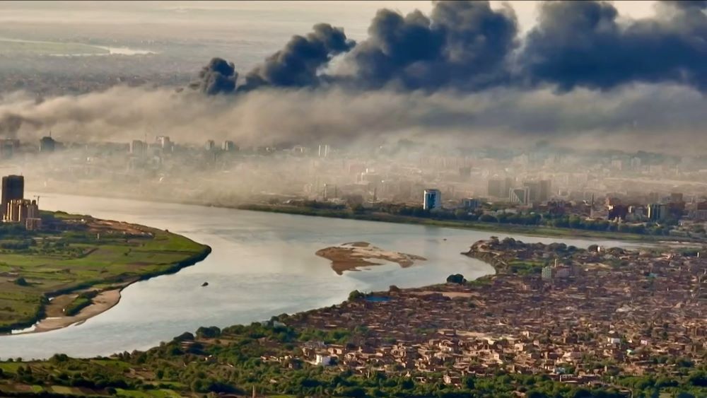 This video grab taken from AFPTV video footage on April 19, 2023, shows an aerial view of black smoke covering the sky above the capital Khartoum. (AFP)
