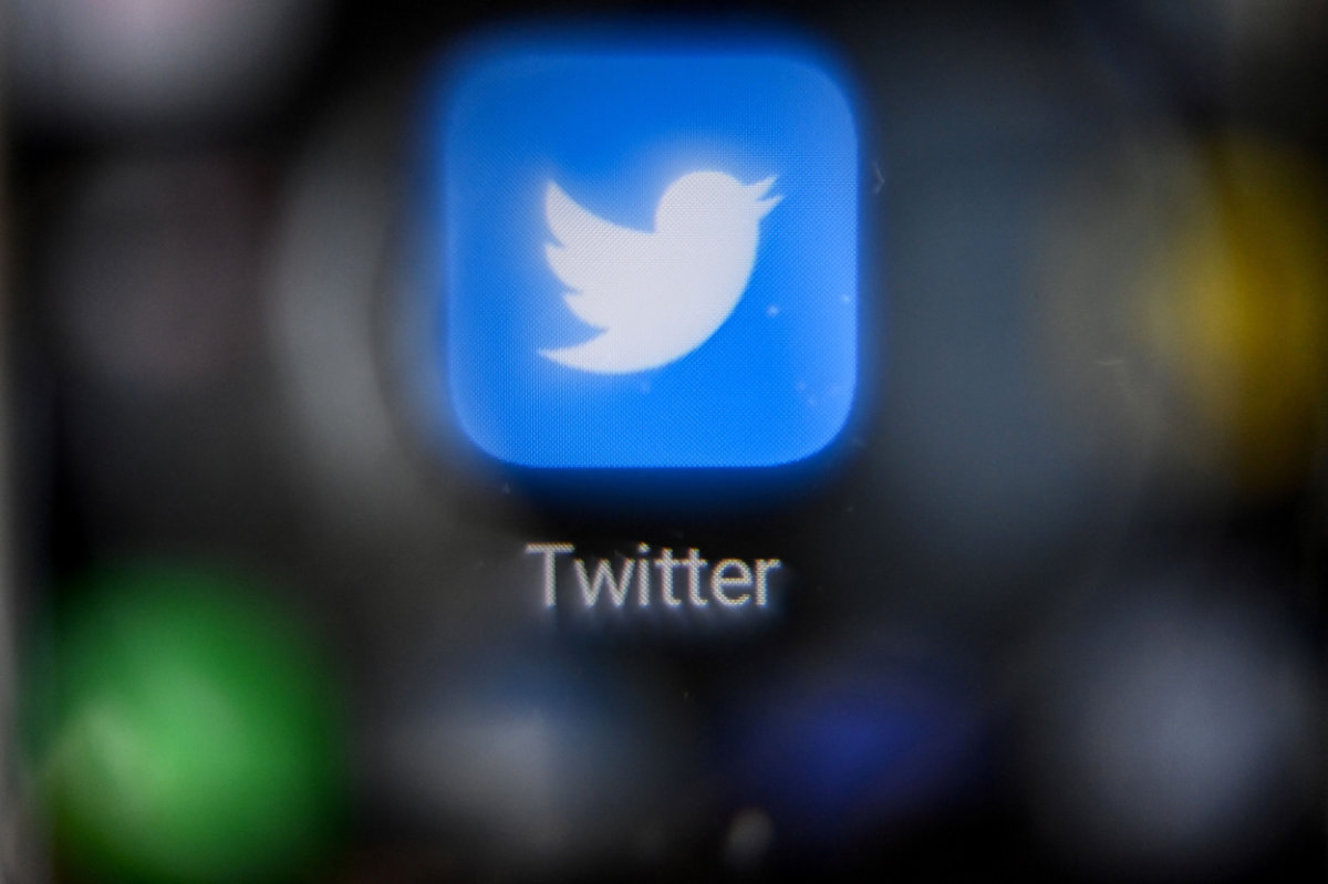 A blue check mark on a Twitter account means the identity of the owner has been verified as real. (AFP)