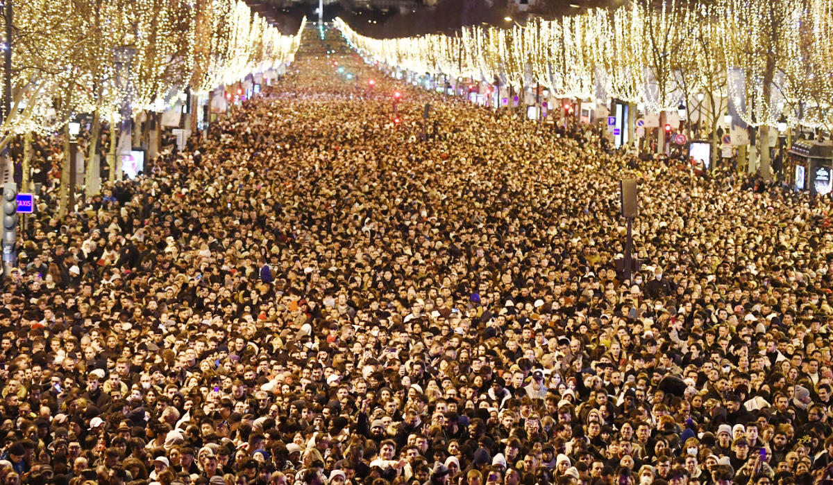 People gather on the Champs-Elysees for New Year’s Eve celebrations. (File/AFP)