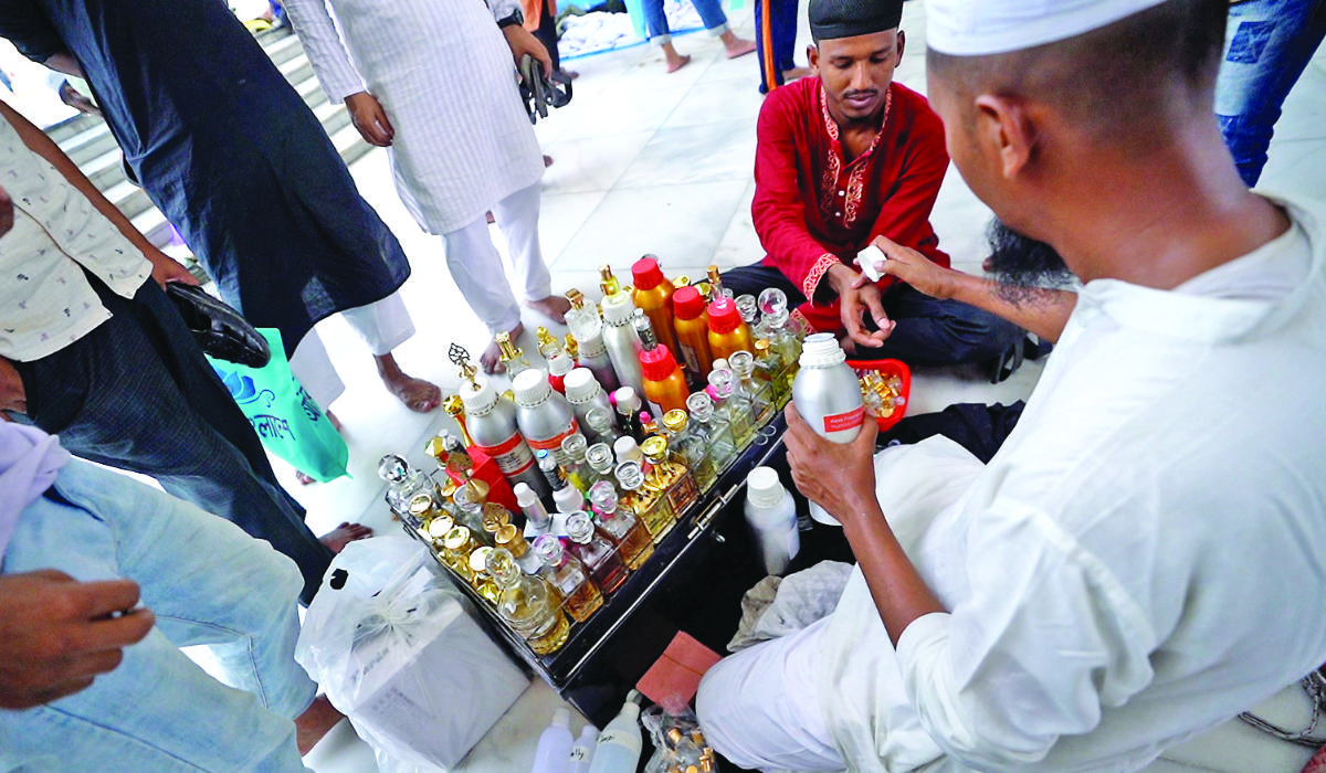 Ahead of eid, buyers swarm attar shops in Dhaka’s Baitul Mukarram Market. Saudi and emirati oils are the most popular among Bangladeshi buyers. (Supplied)