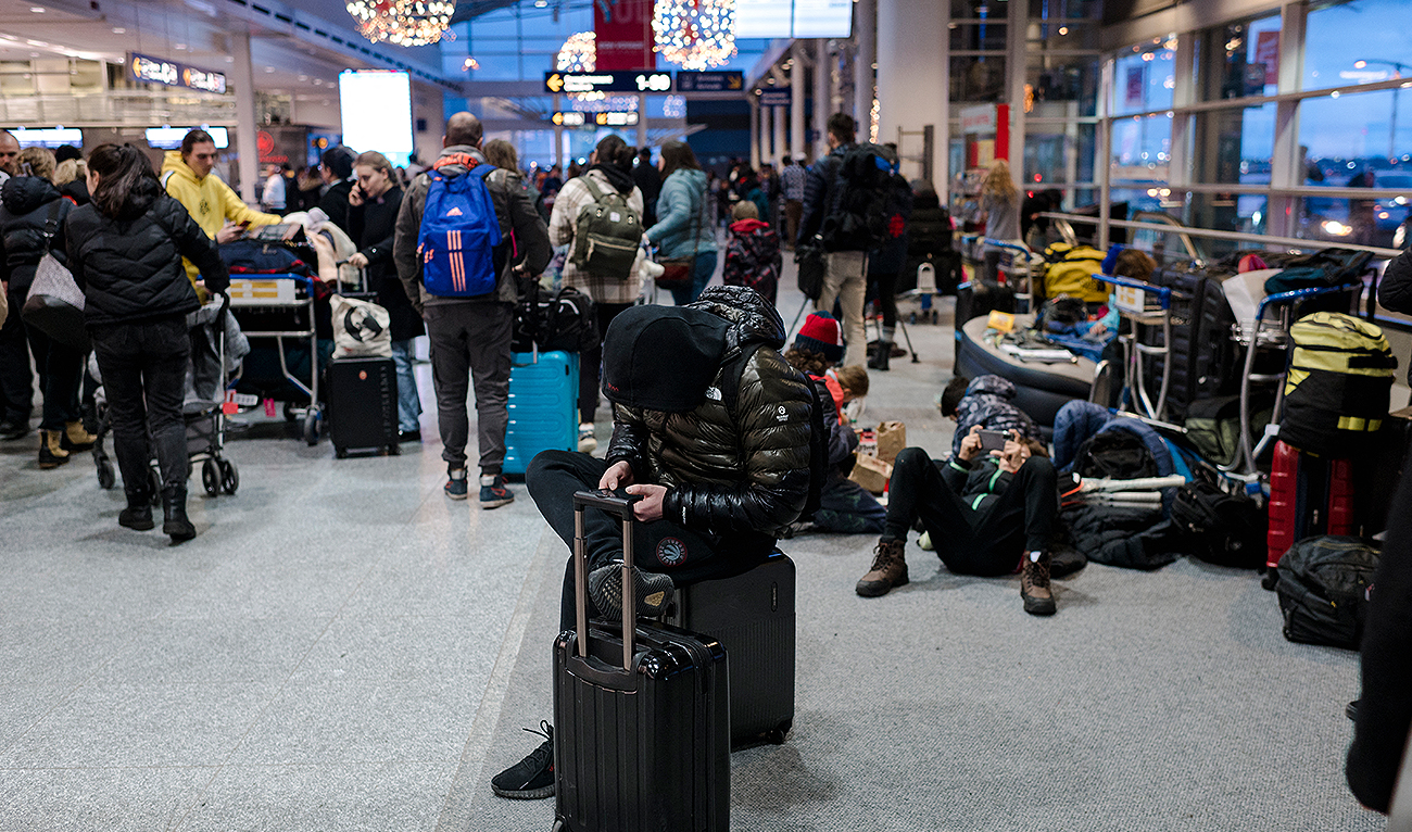 Travelers wait at the Pierre-Elliot Trudeau International Airport in Montreal, Quebec, Canada on December 23, 2022. (Photo courtesy: AFP/File)
