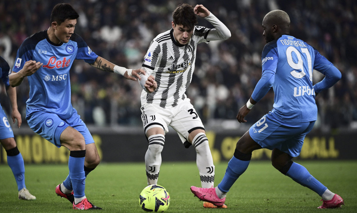 Napoli's Min-jae Kim, left, and Tanguy Ndombele challenge Juventus' Matias Soule Malvano for the ball during the Italian Serie A soccer match between Juventus and Napoli at the Allianz stadium in Turin, Italy on April 23, 2023. (AP)