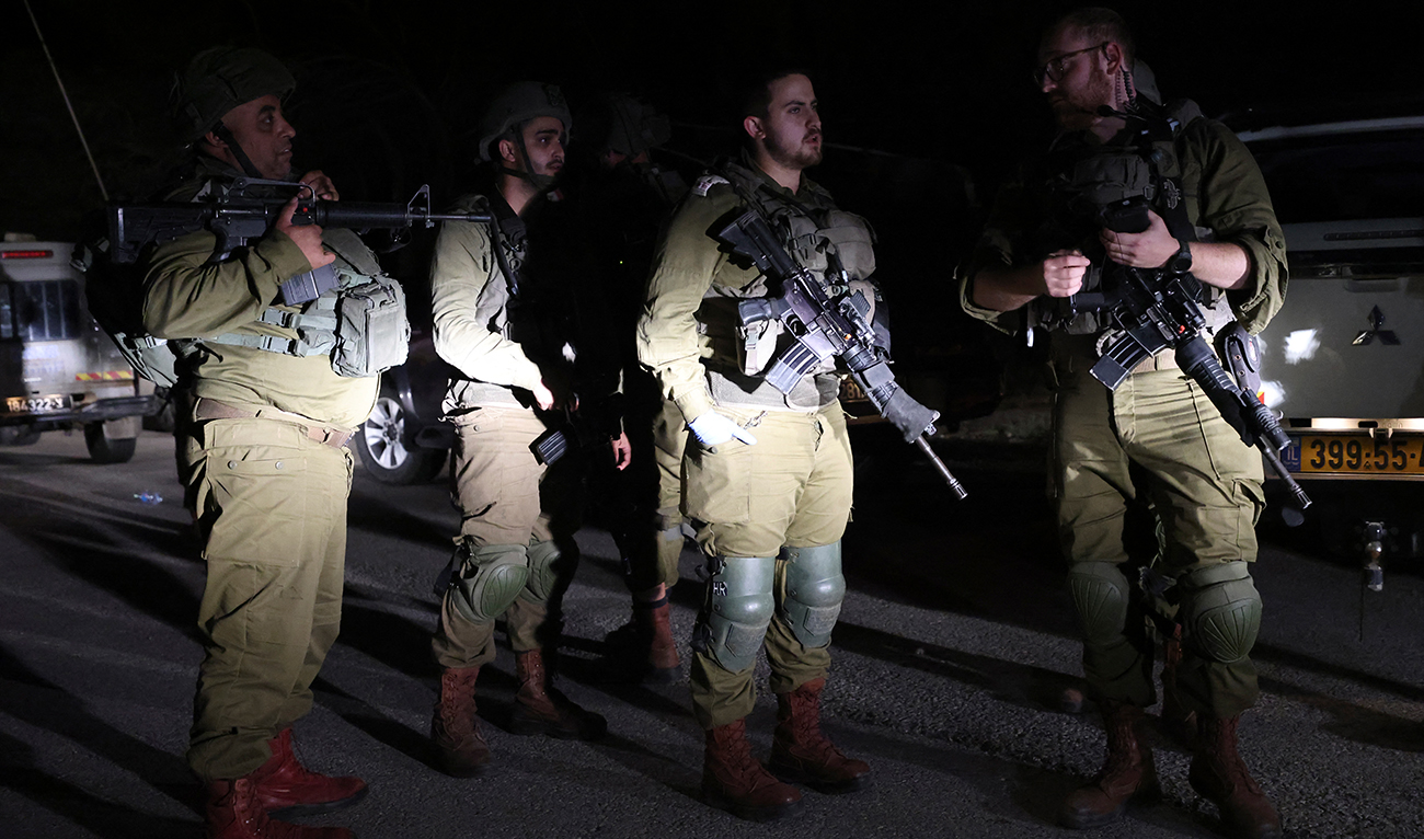 Israeli soldiers patrol Kibbutz Natur in the Israeli-annexed Golan Heights, April 9, 2023. (AFP/FILE)