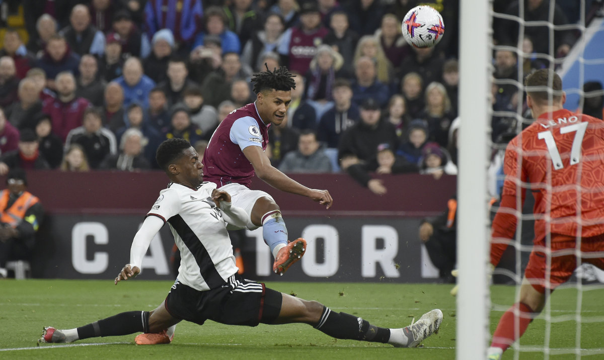 Aston Villa's Tyrone Mings, center, takes a shot at goal during the English Premier League soccer match between Aston Villa and Fulham at Villa Park in Birmingham, England Tuesday. (AP)