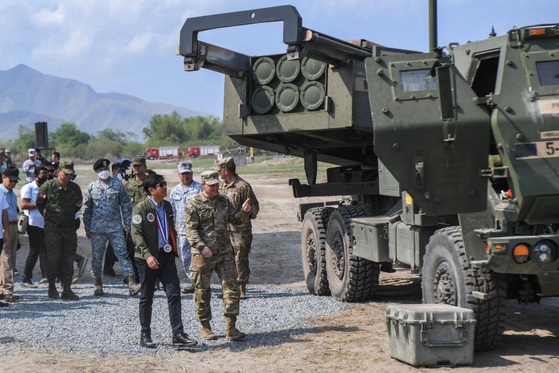 Philippine President Ferdinand Marcos, center left, inspects a high mobility artillery rocket system prior to a live fire exercise as part of the US-Philippines Balikatan joint exercise on April 26, 2023. (AFP)