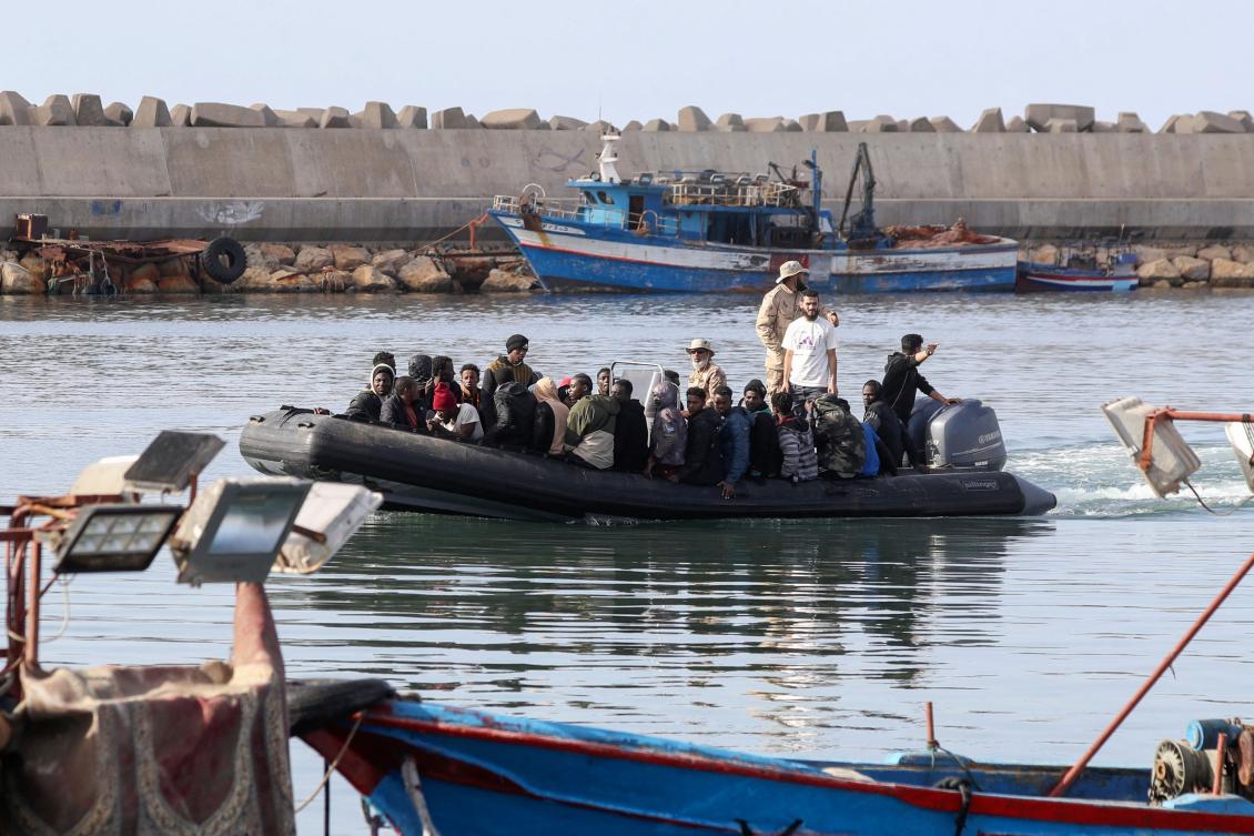 Boats transporting migrants enter a port in the Garabulli area following their rescue at sea by the Libyan Coast Guard. (File/AFP)